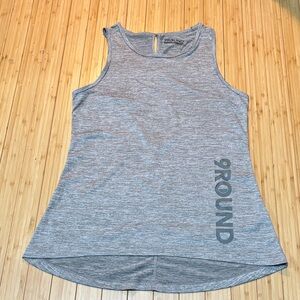 9 Round criss cross back tank top. High low hem. Size S.